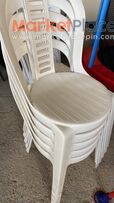 17 white plastic chairs